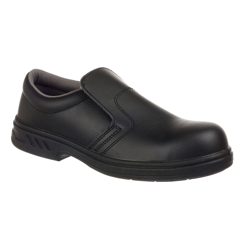 A black safety trainer with a composite toecap, a cushioned insole, and a lightweight anti-slip sole, suitable for lighter-duty site work.
