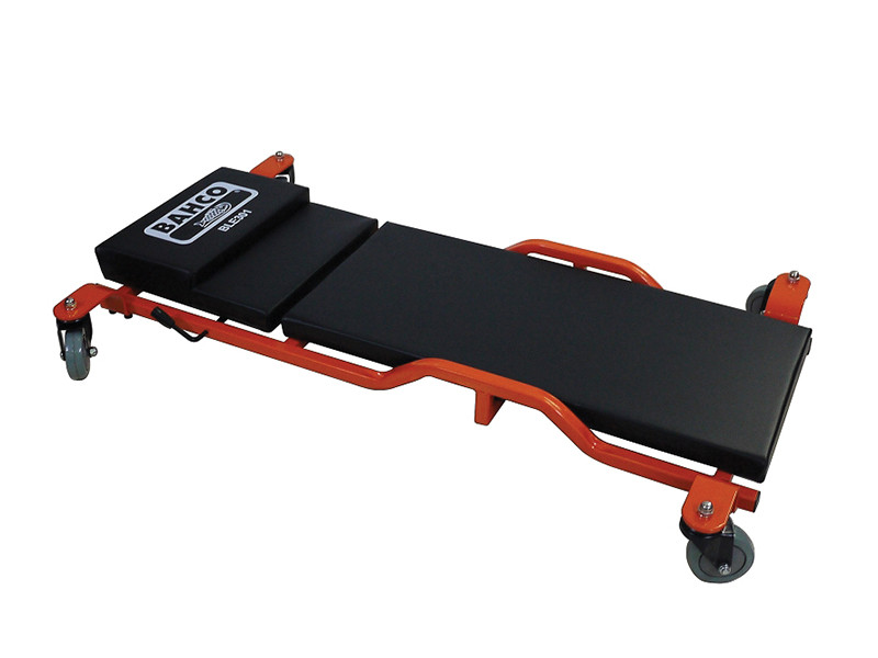 A black and orange mechanics creeper with padded sections, a headrest labeled BAHCO, and four swivel caster wheels for easy movement.