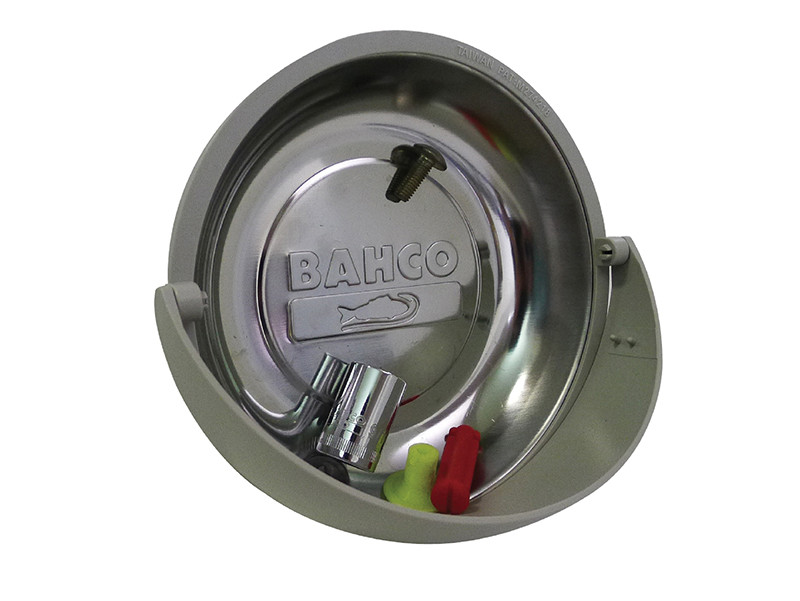 A round metal dish labeled BAHCO holds small tools including a bolt, a socket, and plastic pieces. The dish is mounted in a gray plastic holder.