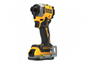 A yellow and black DEWALT 18V cordless impact driver is shown standing upright, featuring a POWERSTACK battery and a metal belt clip on the base.