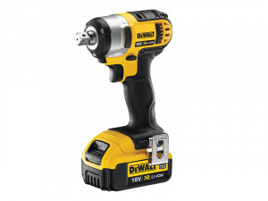 A yellow and black DeWalt 18V XR Li-Ion cordless impact wrench, standing upright on its battery base with a metal belt clip attached to the side.