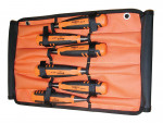 A set of five orange and black screwdrivers in a partially open orange fabric tool roll with individual slots for each tool. The roll has metal grommets on the corners for hanging or securing.,