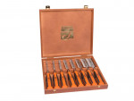 A wooden box set containing eight Bahco chisels with orange and black handles, arranged neatly in individual slots inside the open case.