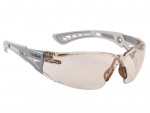 A pair of sporty safety glasses with beige-tinted wraparound lenses and gray, ventilated arms. The design features angular accents and a comfortable nose bridge.