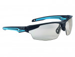 Sporty wraparound sunglasses with a black and blue frame, partially rimless clear lenses, and a bold, angular design. The brand “Bollé” is visible on the left temple arm.