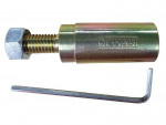 A DeWalt branded metal bolt puller tool with a hex bolt and a cylindrical body, shown alongside an L-shaped hex key.