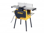 A DeWalt benchtop jointer with a yellow and black body, silver worktable, and four black legs, shown plugged in and ready for use.