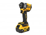 A yellow and black DeWalt 18V XR cordless impact driver with a 5Ah lithium-ion battery, ergonomic handle, and compact design, shown on a white background.