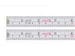 Two white measuring tapes are shown side by side, marked with both inch and centimeter units, with numbers in black and red. The brand name Stabila appears in pink near the 3-inch and 7-centimeter marks.