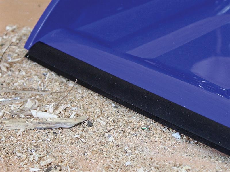 A brush with natural or synthetic bristles and an ergonomic handle, for applying coatings or cleaning surfaces.