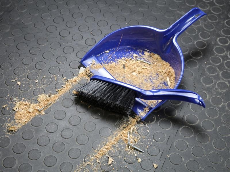 A brush with natural or synthetic bristles and an ergonomic handle, for applying coatings or cleaning surfaces.