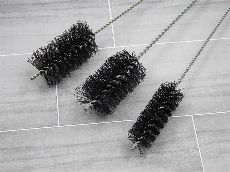 A brush with natural or synthetic bristles and an ergonomic handle, for applying coatings or cleaning surfaces.