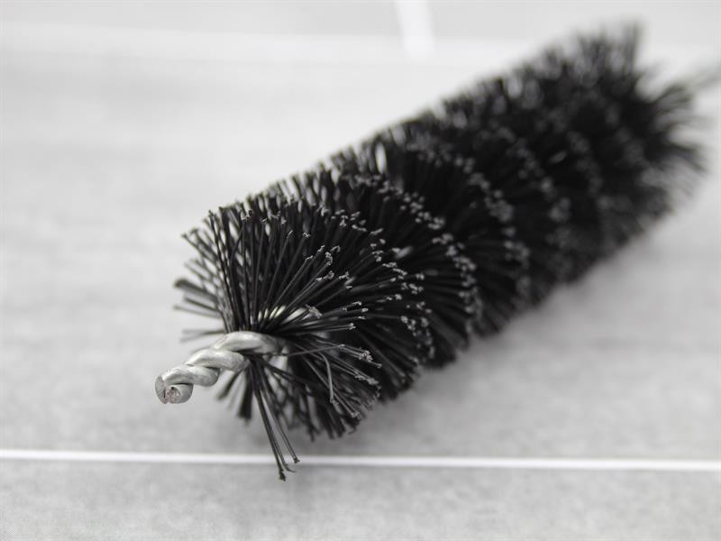 A brush with natural or synthetic bristles and an ergonomic handle, for applying coatings or cleaning surfaces.
