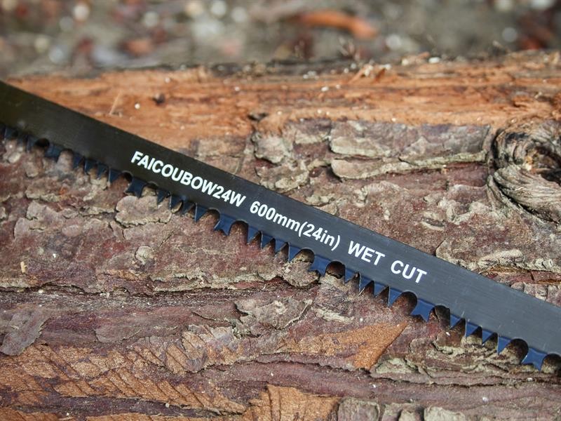 A saw with a hardened blade and a comfortable handle, for cutting timber, metal, or masonry.