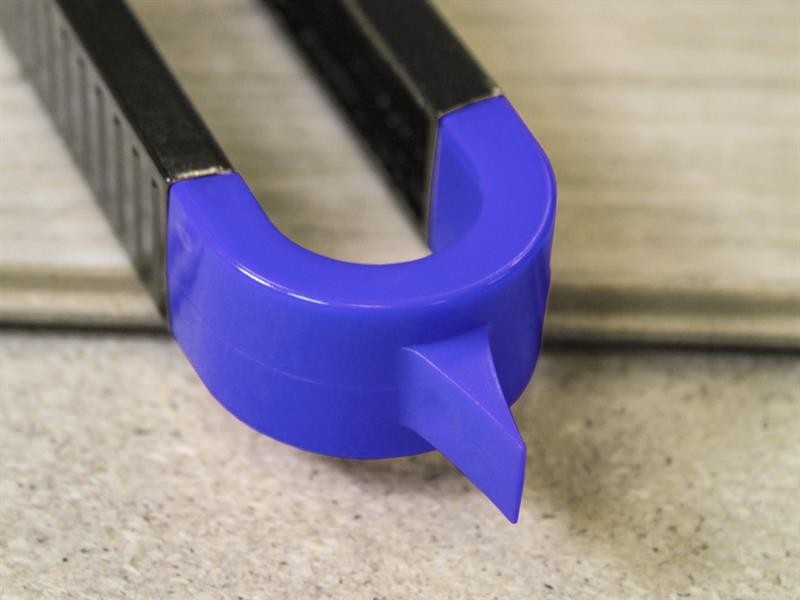 A Faithfull needle file with a hardened steel abrasive surface and a turned wooden or synthetic handle, for shaping and deburring metal.