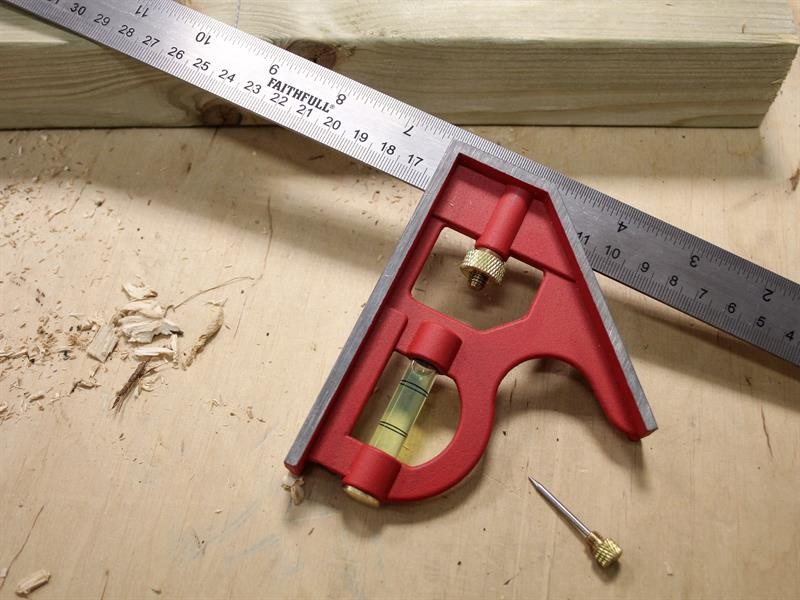 A Faithfull combination square with a graduated steel blade, a removable stock, a built-in level vial, and a scribe, for layout and checking angles.