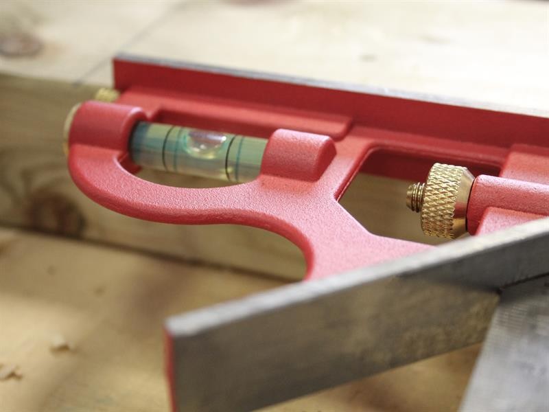 A Faithfull combination square with a graduated steel blade, a removable stock, a built-in level vial, and a scribe, for layout and checking angles.