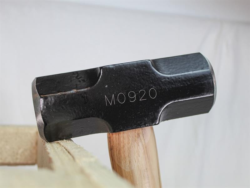 A 3.18kg sledgehammer with a heavy steel head and a long wooden handle, for heavy demolition, driving stakes, and breaking up masonry.