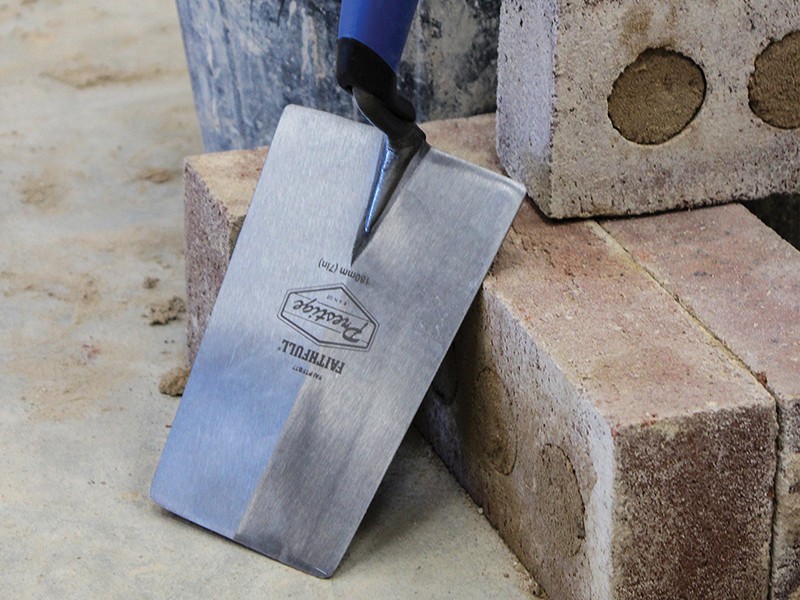 A Faithfull bucket trowel with a rounded rectangular blade and a polymer handle, for scooping and spreading render and mortar.