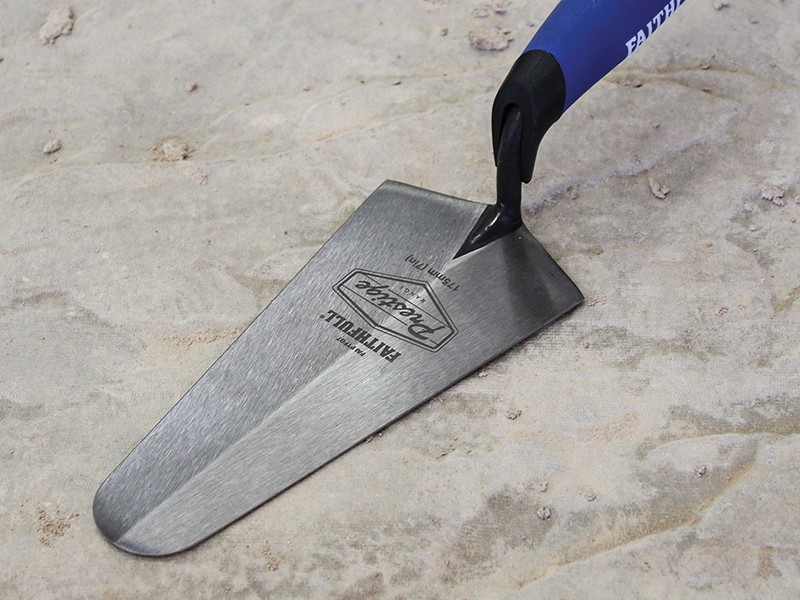 A Faithfull gauging trowel with a rounded heel steel blade, used for measuring and mixing small batches of mortar or adhesive.