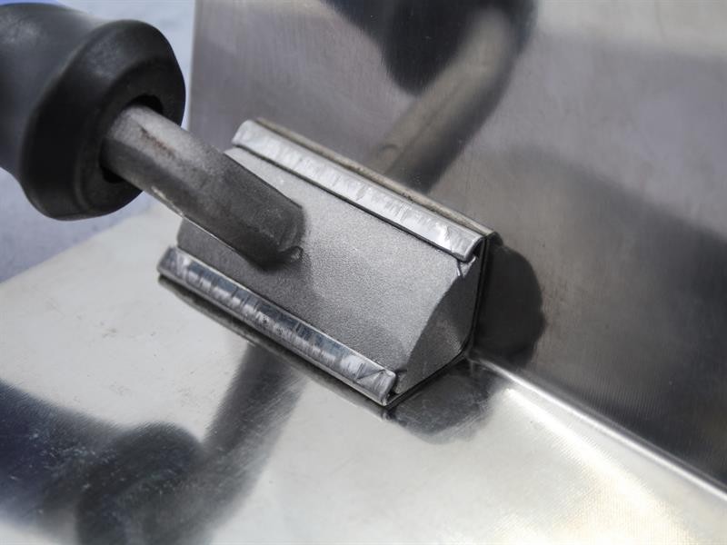 A Faithfull trowel with a polished steel blade and an ergonomic handle, for applying and finishing mortar, plaster, and adhesive.