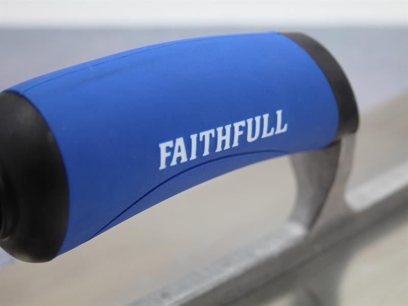 A Faithfull plasterer's finishing trowel with a thin, flexible steel blade and a turned wooden handle, for achieving smooth plaster surfaces.