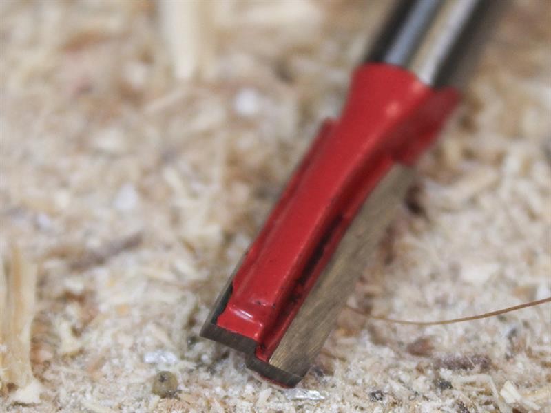 A Faithfull plunge router with a fine depth adjuster and a guide fence, for cutting grooves, rebates, and profiles in timber.