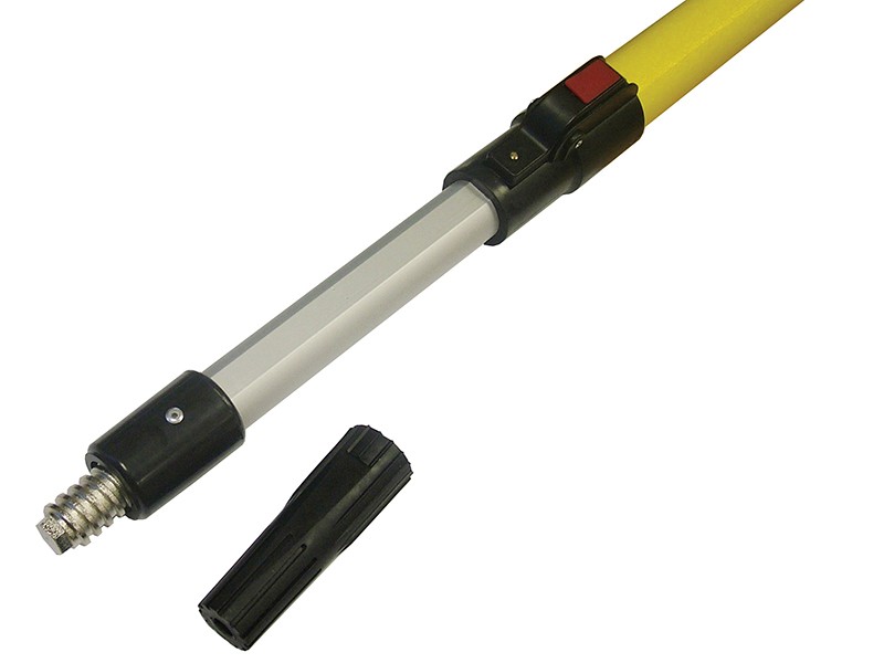 A close-up of a yellow telescopic pole with a metal threaded tip and a detachable black plastic end cap placed beside it. The pole has a red locking button.,