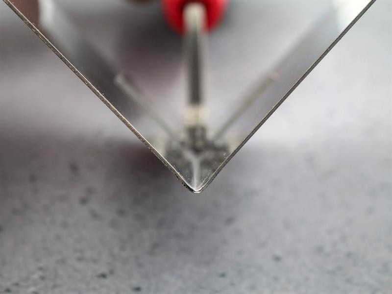 A Faithfull trowel with a polished steel blade and an ergonomic handle, for applying and finishing mortar, plaster, and adhesive.