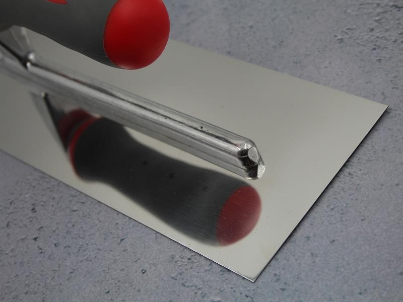 A Faithfull trowel with a polished steel blade and an ergonomic handle, for applying and finishing mortar, plaster, and adhesive.