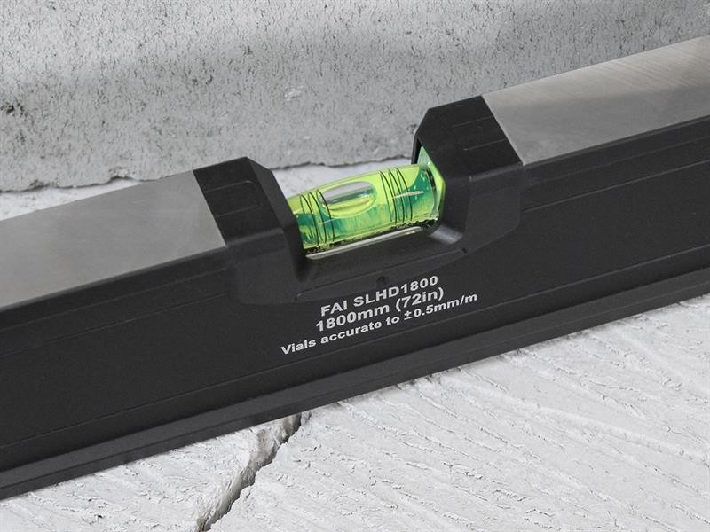 A Faithfull 180cm spirit level with an extruded aluminium body and accurate vials, for checking horizontal and vertical alignment.