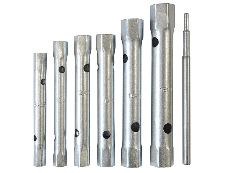 A set of six metal tubular box spanners of varying sizes and one matching metal rod, all arranged upright in a row on a white background.