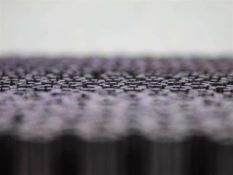 A brush with natural or synthetic bristles and an ergonomic handle, for applying coatings or cleaning surfaces.