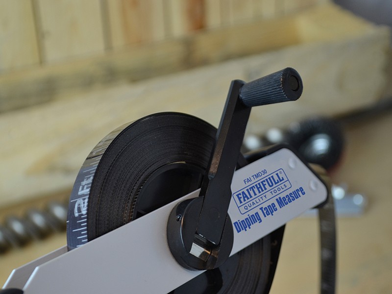 A Faithfull 30m retractable tape measure with a blade, a rubberised case, and a belt clip, for general site measurement.