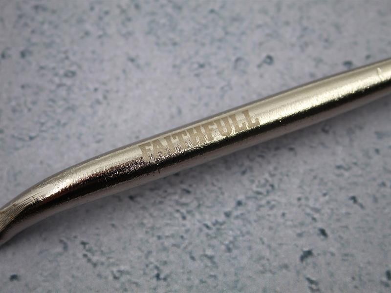 A Faithfull trowel with a polished steel blade and an ergonomic handle, for applying and finishing mortar, plaster, and adhesive.