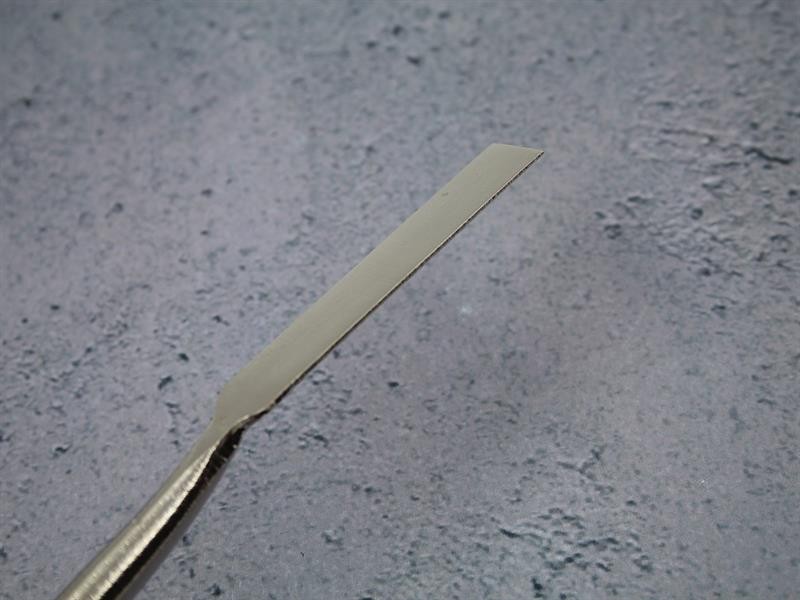 A Faithfull trowel with a polished steel blade and an ergonomic handle, for applying and finishing mortar, plaster, and adhesive.