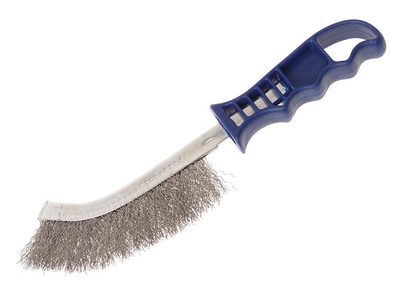 A wire brush with steel or brass bristle rows in a wooden or plastic handle, for removing rust, scale, and surface contaminants from metal.