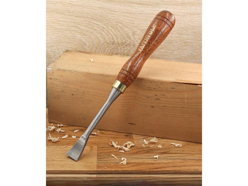 A hardened steel chisel with a bevelled cutting edge and a square-section body, for cutting stone, brick, or timber.