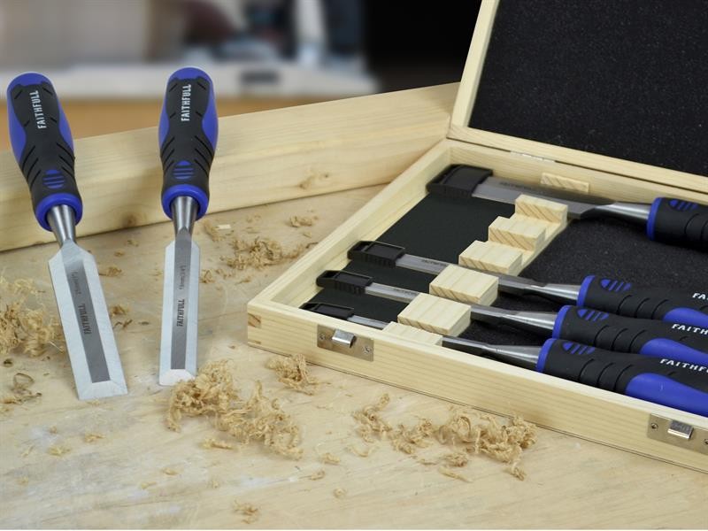 A hardened steel chisel with a bevelled cutting edge and a square-section body, for cutting stone, brick, or timber.