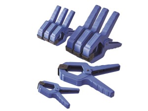 A spring clamp with a plastic or steel body and non-slip pads, for quickly holding lightweight assemblies and sheets.