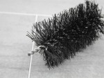 A brush with natural or synthetic bristles and an ergonomic handle, for applying coatings or cleaning surfaces.