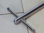 A Faithfull basin wrench with a swivelling jaw on a long telescopic shaft, for tightening and removing tap back-nuts in confined under-sink spaces.