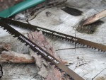 A saw with a hardened blade and a comfortable handle, for cutting timber, metal, or masonry.