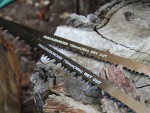 A saw with a hardened blade and a comfortable handle, for cutting timber, metal, or masonry.