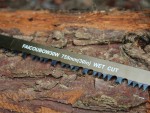 A saw with a hardened blade and a comfortable handle, for cutting timber, metal, or masonry.