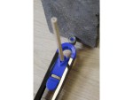 A Faithfull needle file with a hardened steel abrasive surface and a turned wooden or synthetic handle, for shaping and deburring metal.