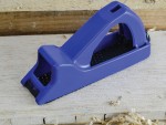 A Faithfull needle file with a hardened steel abrasive surface and a turned wooden or synthetic handle, for shaping and deburring metal.