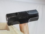 A 3.18kg sledgehammer with a heavy steel head and a long wooden handle, for heavy demolition, driving stakes, and breaking up masonry.