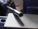 A steel hex nut with an internally threaded profile, for use with a matching bolt or threaded rod.