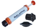 A handheld Hydro Jet Pump with orange and black ends, featuring a plunger handle, lies next to two black plastic attachments on a white background.